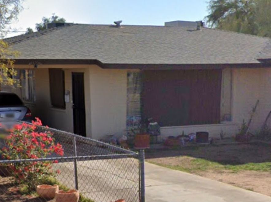 Older single-story home with worn exterior, suitable for renovation or cash purchase.