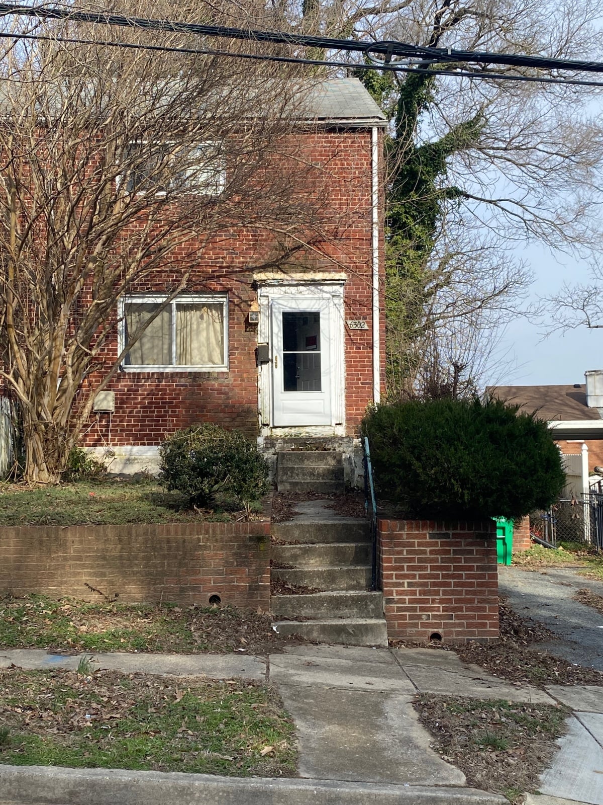 Single-story home with visible exterior wear, ideal for a fixer-upper purchase.