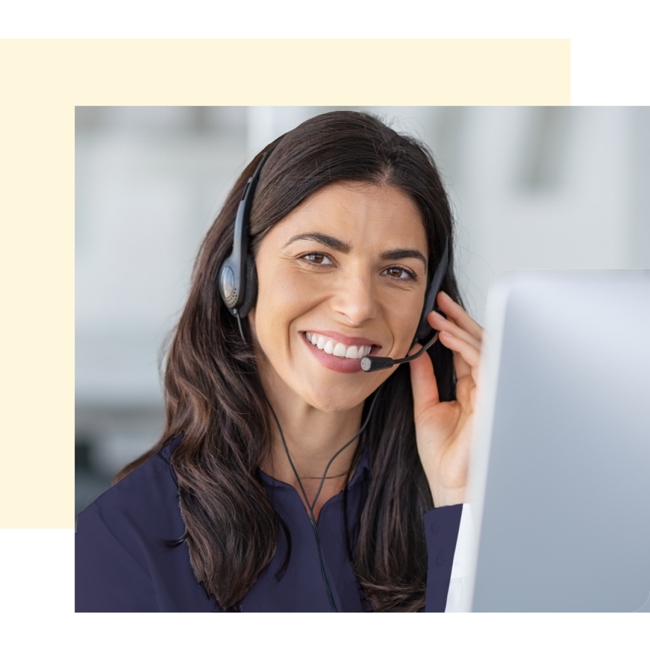 Smiling woman using phone headset