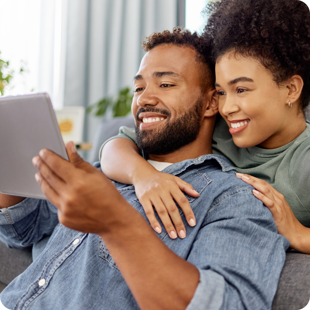 Young Couple Looking at the IPad 