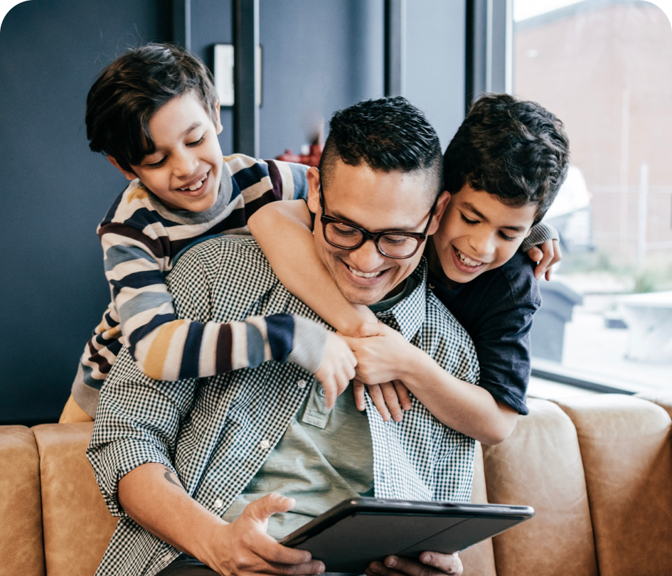 Father and Sons Using Tablet