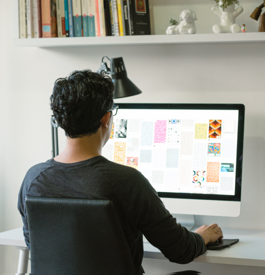 Man sitting at desktop computer