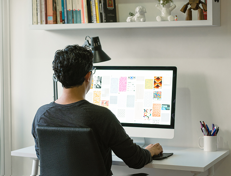 Man sitting at desktop computer