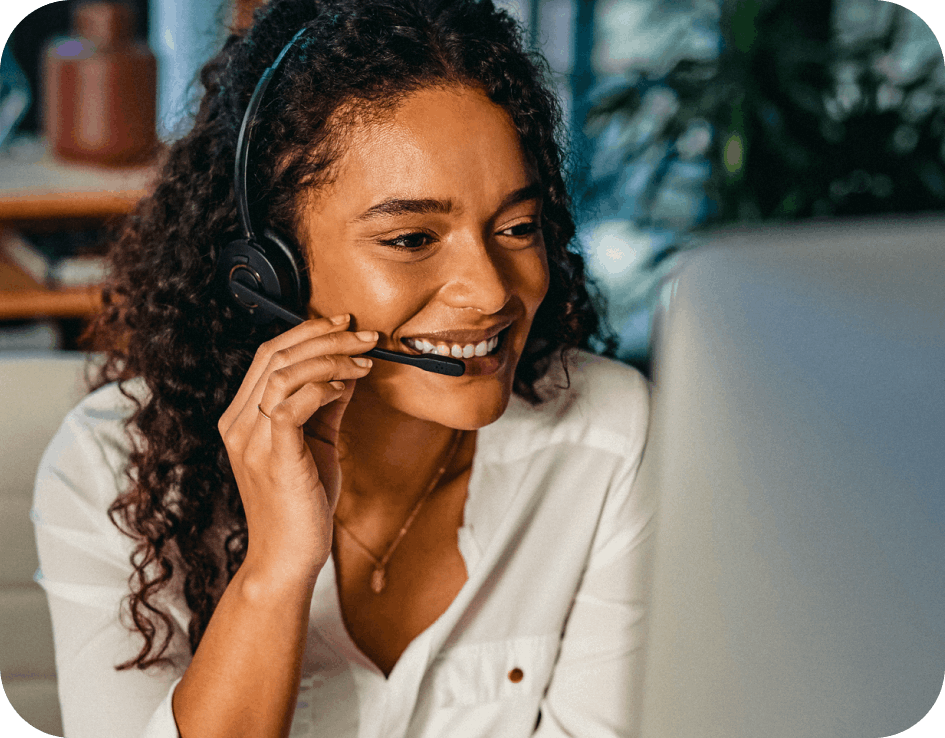 Lady answering call to give best in class fraud support smiling