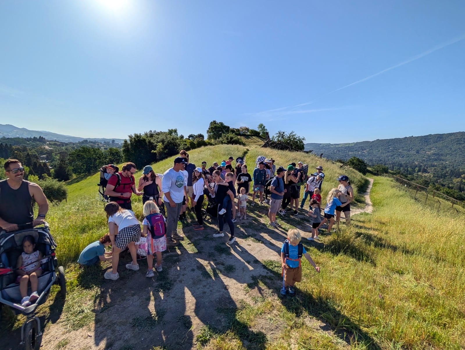 Parents with toddlers in carriers on an East Bay trail