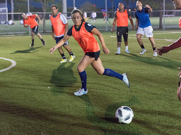 girl with a soccer ball at a meetup event